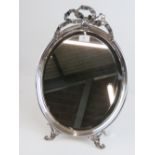 An impressive HM silver (hallmarks worn) freestanding oval easel table mirror having bevelled edge