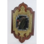 A fine and decorative wall mirror with mahogany base,