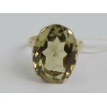 A vintage 9ct gold citrine cocktail ring, the huge central oval cut citrine approx 22 x 16 x 9.