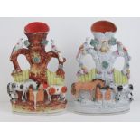 Staffordshire flatbacks; pair of spill vases decorated with animals upon, 25cm high, a/f.