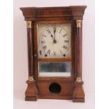 An eight day striking spring table clock by Seth Thomas having tin plate dial with Roman numerals,