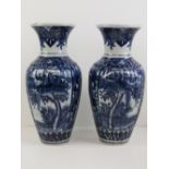 A good pair of 19th Century heavy oriental export blue and white ribbed shoulder vases,