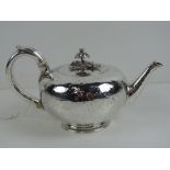A delightful William IV HM silver teapot having floral finial and engraved decoration throughout,