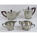 A hammered pewter four piece tea set as made by Period Pewter comprising teapot, hot water pot,