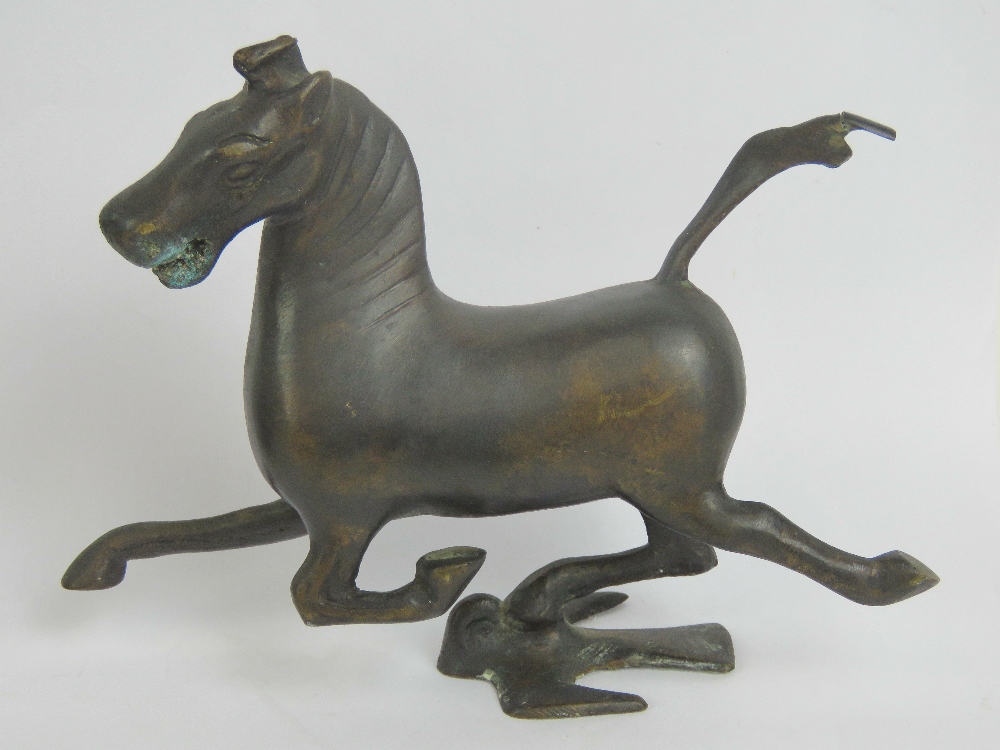 A 20th century Oriental bronze stylised horse figurine, 15cm in length.