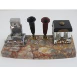 A marble based desk tray having twin pen holders, double recess inkwell and perpetual calendar,