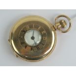 A Waltham half hunter gold plated pocket watch having Dennison moon case,