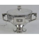 An Art Deco silver plated wafer box complete with lid and twin handles, 14cm wide.