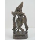 A 19th century cast brass Indo-Asian deity standing 21cm high.