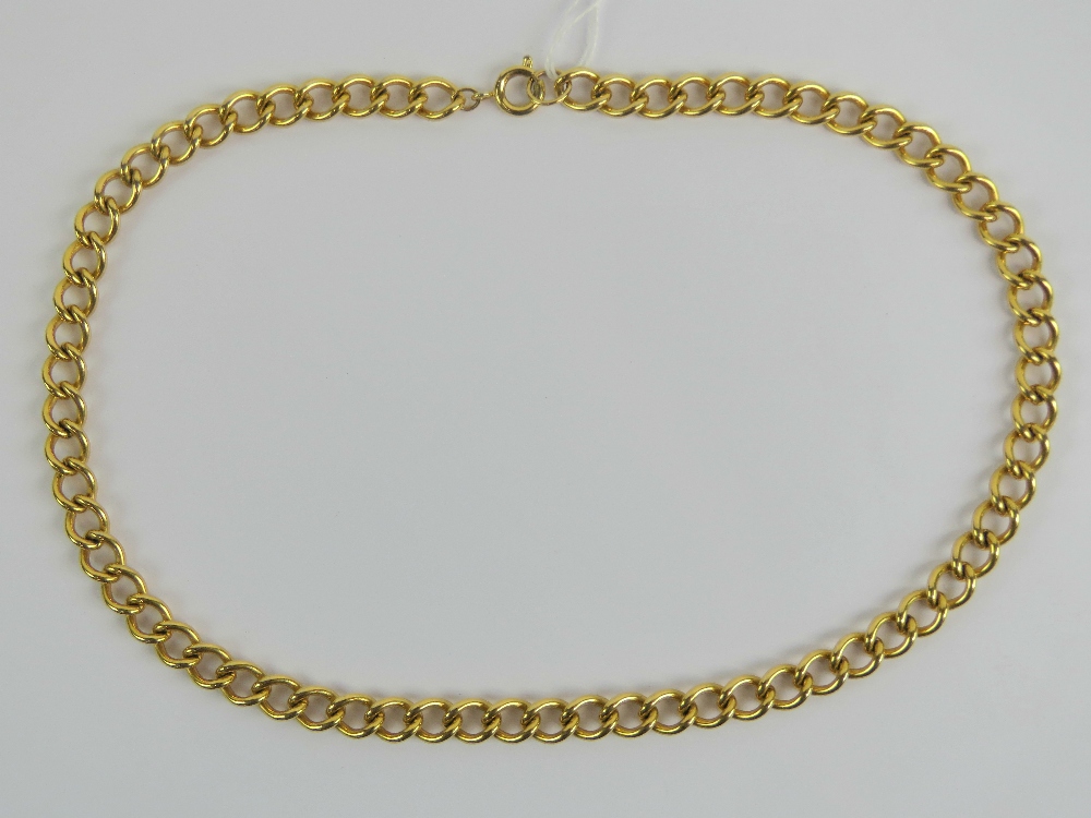 A yellow metal curb link chain measuring 46cm in length.