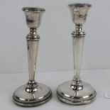 A pair of HM silver single sconce candlesticks, a/f, hallmarked Birmingham 1930,