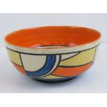 A Clarice Cliff Bizarre hand painted bowl in oranges yellows and blues, 19cm diameter.