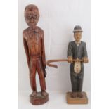 A contemporary carved wooden freestanding figurine, 82cm high,
