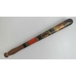 A Victorian truncheon having black ground painted crown with VR cypher, beehive handle,