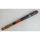 A Victorian truncheon having black ground painted crown and VR cypher, marked 'Police' upon,