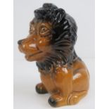 A glazed lion figurine moneybox standing 23cm high.