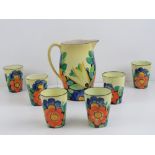 A rare early Susie Cooper lemonade set comprising lemonade jug and six beakers each standing 9.