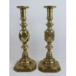 Two good brass candlesticks with ejectors, each standing 31cm high.