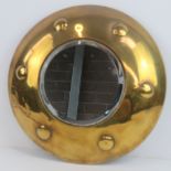 A circular brass wall mirror, 30cm dia.