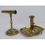 A brass ejector chamberstick, together with a wall sconce candlestick. Two items.