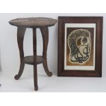 A small carved wooden table of foliate form raised over three supports, 50cm high.