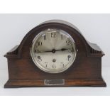 A three train oak cased mantle clock having HM silver presentation marriage plate for 1937.