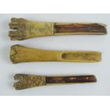 Three carved bone 'spoons' one bearing engraved date 1749, 13cm to 11cm.