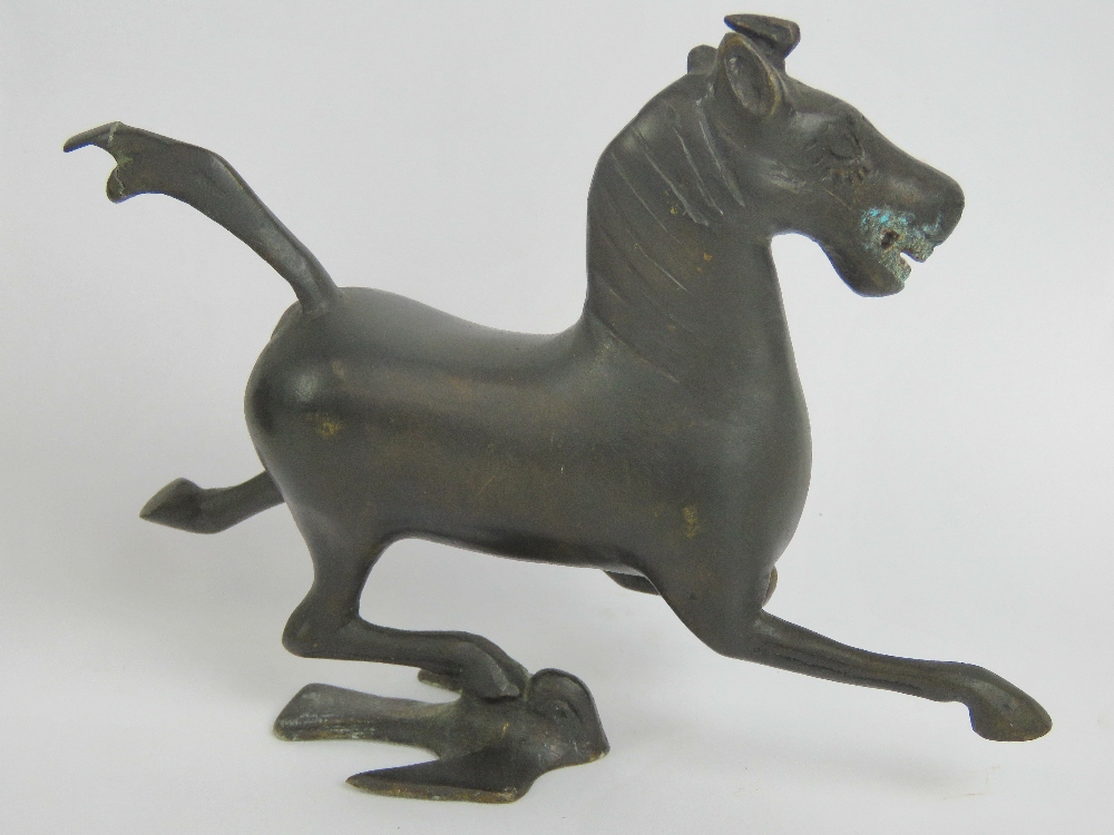 A 20th century Oriental bronze stylised horse figurine, 15cm in length. - Image 2 of 2