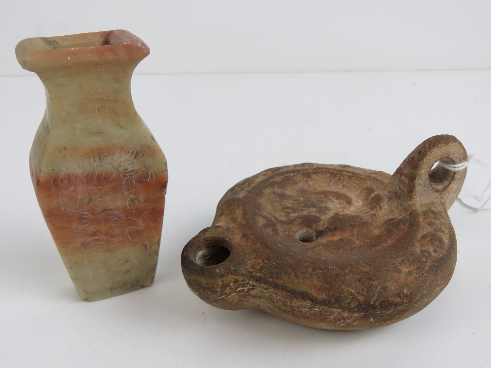 An antique stoneware oil lamp in the Egyptian style, 11cm deep.