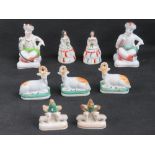 A pair of Staffordshire seated smoking figurines, a/f, together with three other pairs, assorted.