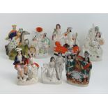 Staffordshire flatbacks; seven assorted figurines ranging in size 19 - 26cm, a/f.