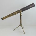 A good 19th century three drawer brass table telescope with adjustable tripod, marked J H Steward,