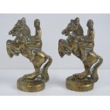 A pair of solid brass opposing rearing horse bookends, each standing 16cm high.