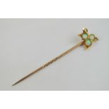A Victorian 18ct gold and opal tie pin in the form of an ivy leaf,