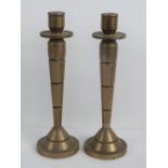A fine pair of heavy Art Deco graduating and banded solid brass candlesticks,