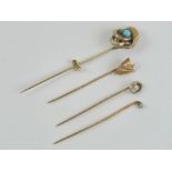 A 9ct gold tie pin having central seed pearl, stamped 9ct,