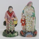 Two 19th century Staffordshire figurines, old woman with stick and basket, 19cm high,