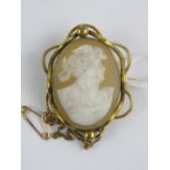 A vintage carved shell cameo in gilt metal brooch setting,