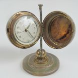 A novelty clock in the form of a globe opening to reveal clock face within, 5.