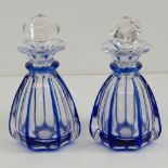 A pair of shaped glass vinaigrette bottles each having cobalt blue edged decoration complete with