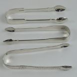 Three HM silver pairs of sugar tongs; one pair with floral engraving, lion passant, no date letter,
