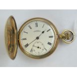 A Waltham full hunter gold plated pocket watch having white enamel dial marked A.W.W.