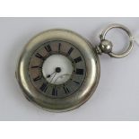 A white metal half hunter key wind pocket watch, blue enamel chapter ring to front,