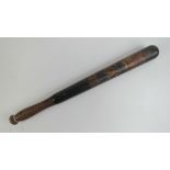 A Victorian truncheon having black ground with painted crown and VR cypher upon with 'LSK' below,