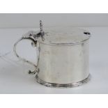 A HM silver mustard pot having clam shell handle and Bristol blue glass liner (liner a/f),