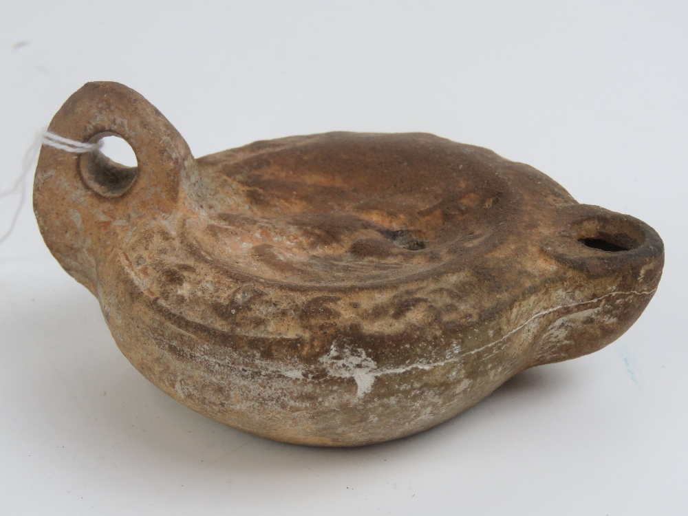 An antique stoneware oil lamp in the Egyptian style, 11cm deep. - Image 3 of 4