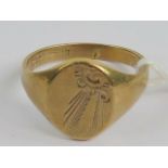 A 9ct gold signet ring having floral engraving upon, no monogram, hallmarked 375, size S-T, 5g.