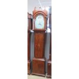 An eight day striking long case clock having arched top painted dial with Arabic and Roman numerals,