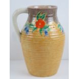 A Clarice Cliff large Canterbury Bells handled jug measuring 29cm high.