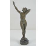 A superb miniature bronze figurine of a standing nude female, 15cm high.